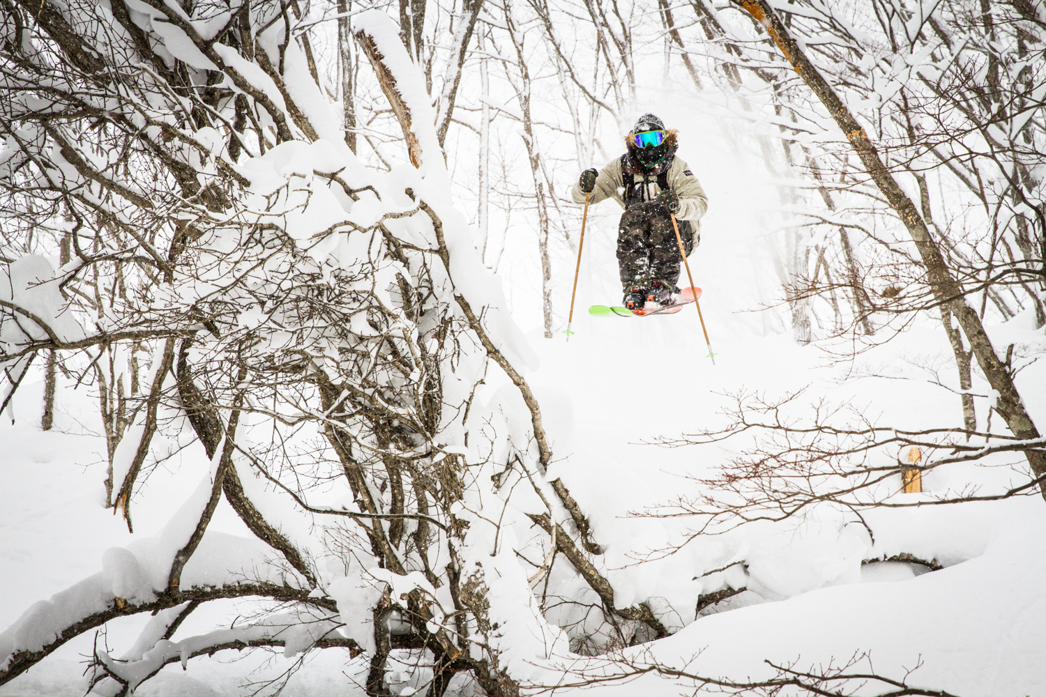 Karl Fostvedt jumps through the trees in Hakuba, Japan while filming for the Tamashii Project.
