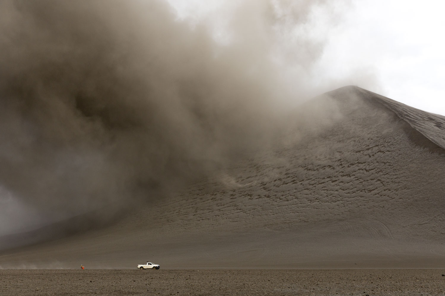 casually taking a ride in front of the volcano