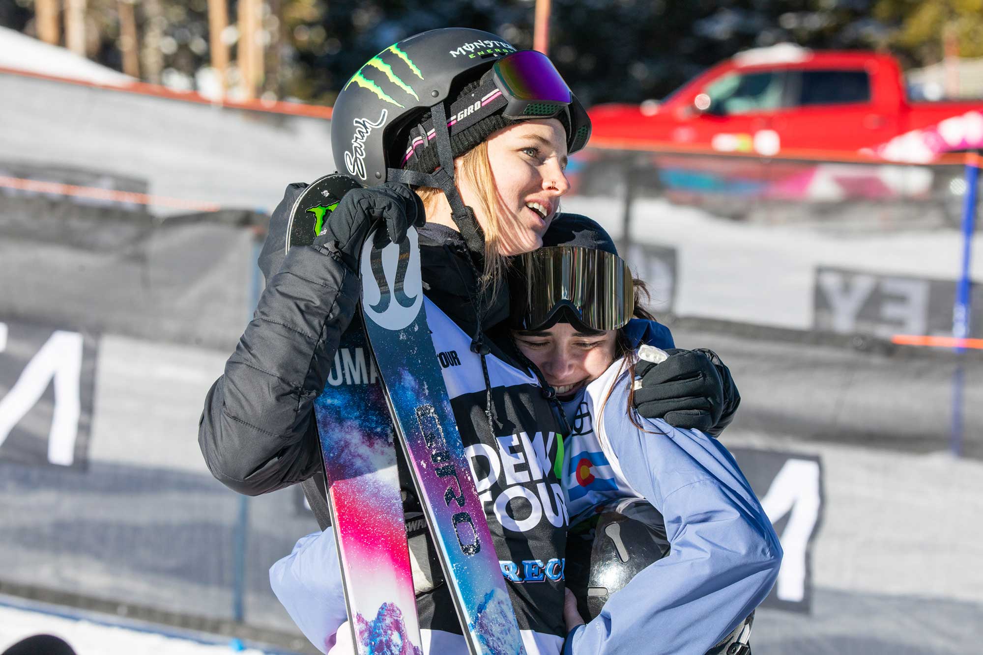 Cassie Sharpe congratulates Rachel Karker at the 2018 Dew Tour women's ski Modified Superpipe contest.