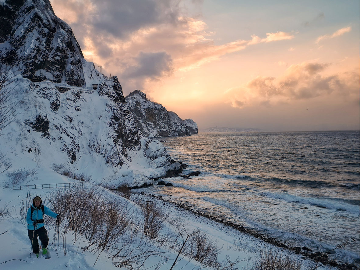 Ski touring along the beach close to Otaru, Japan.