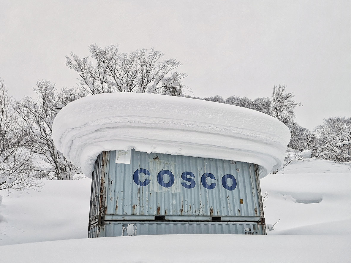 Pillows of snow form on a shipping container in Hokkaido, Japan.