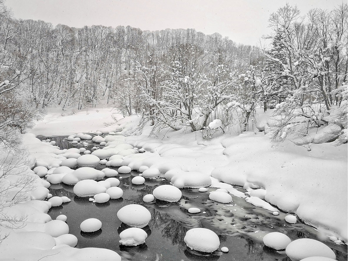 Winter scene of the Shiribetsu River near Niseko, Japan.