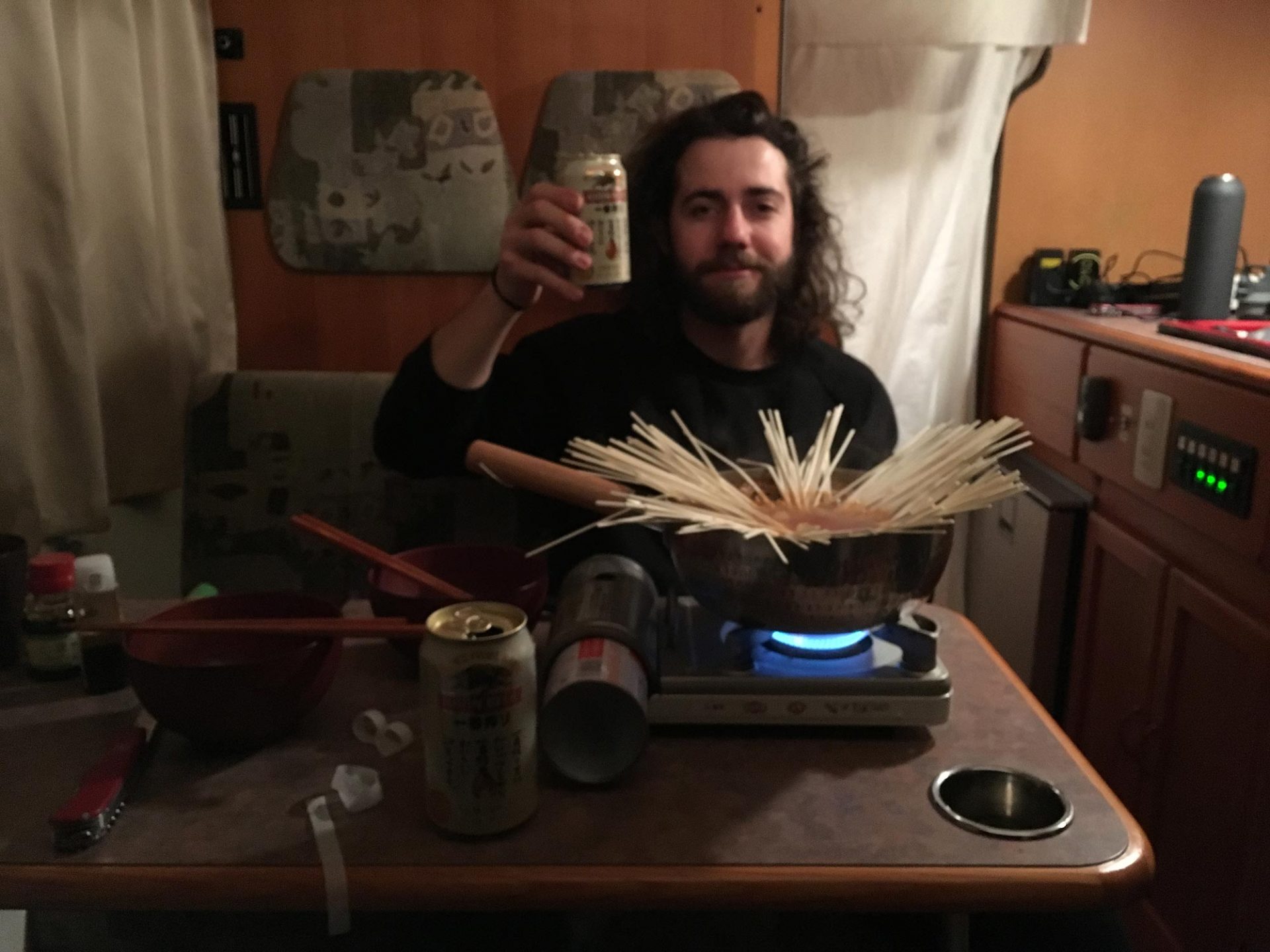 Drinking Kirin and cooking ramen in a Japanese camper van during a ski trip to Hokkaido.