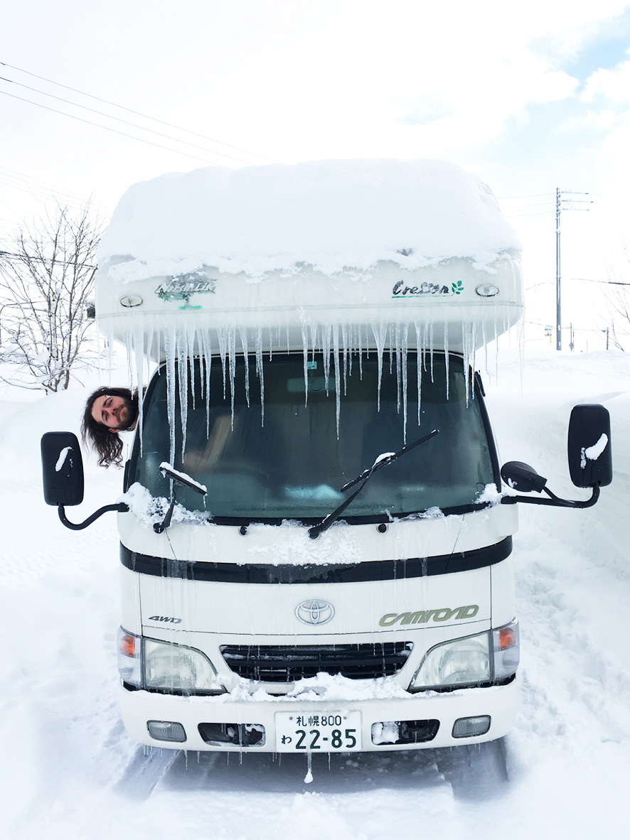Icicles on a camper van during a skiing road trip in Hokkaido, Japan.