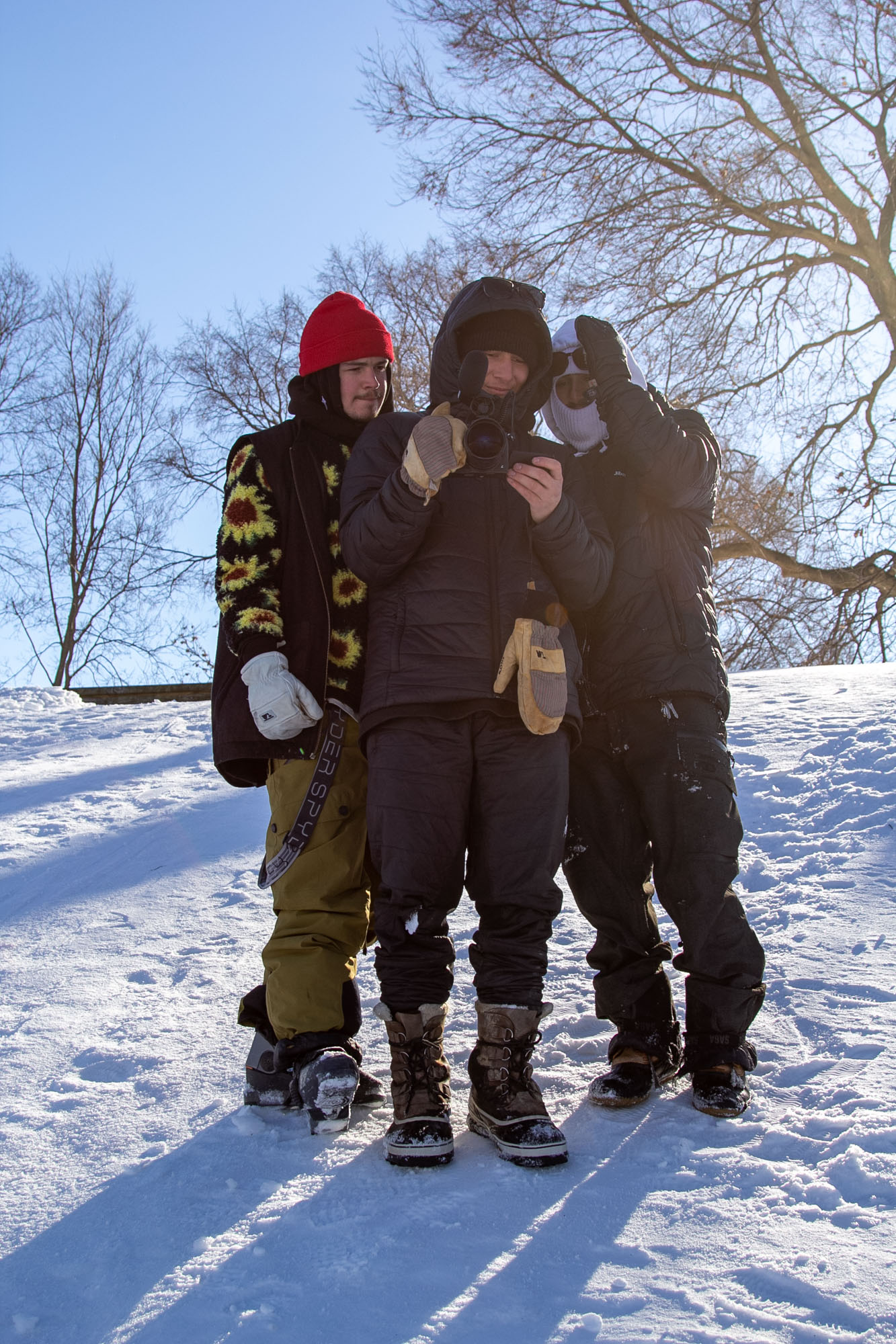 Sam Zahner, Calvin Barrett and Pete Koukov scope the shot while filming for 