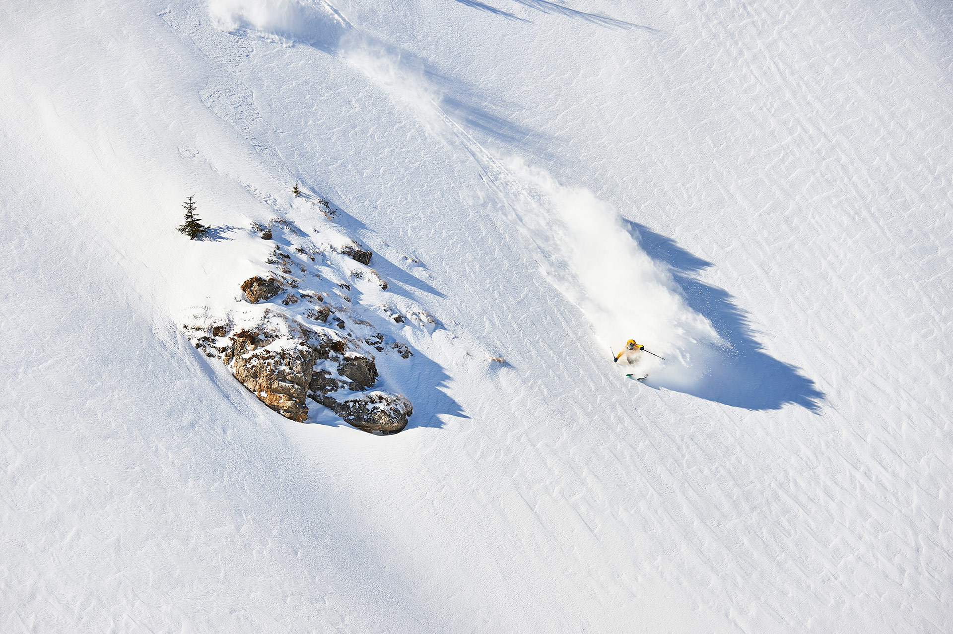 Laurent De Martin enjoys a bluebird powder day at Les Crosets in the Région Dents Du Midi