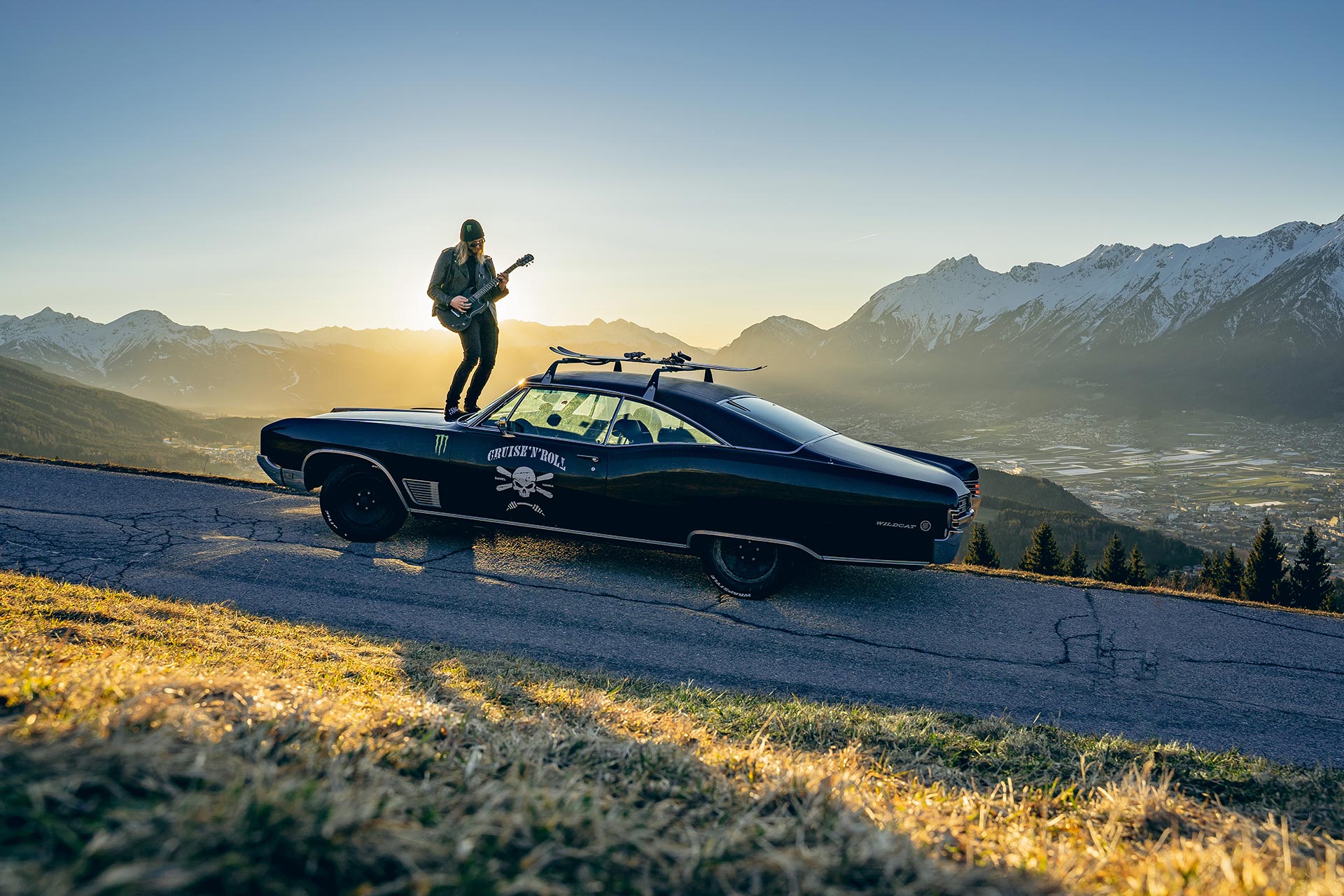 Dan Hanka stands of top of his 1968 Wildcat and plays the guitar