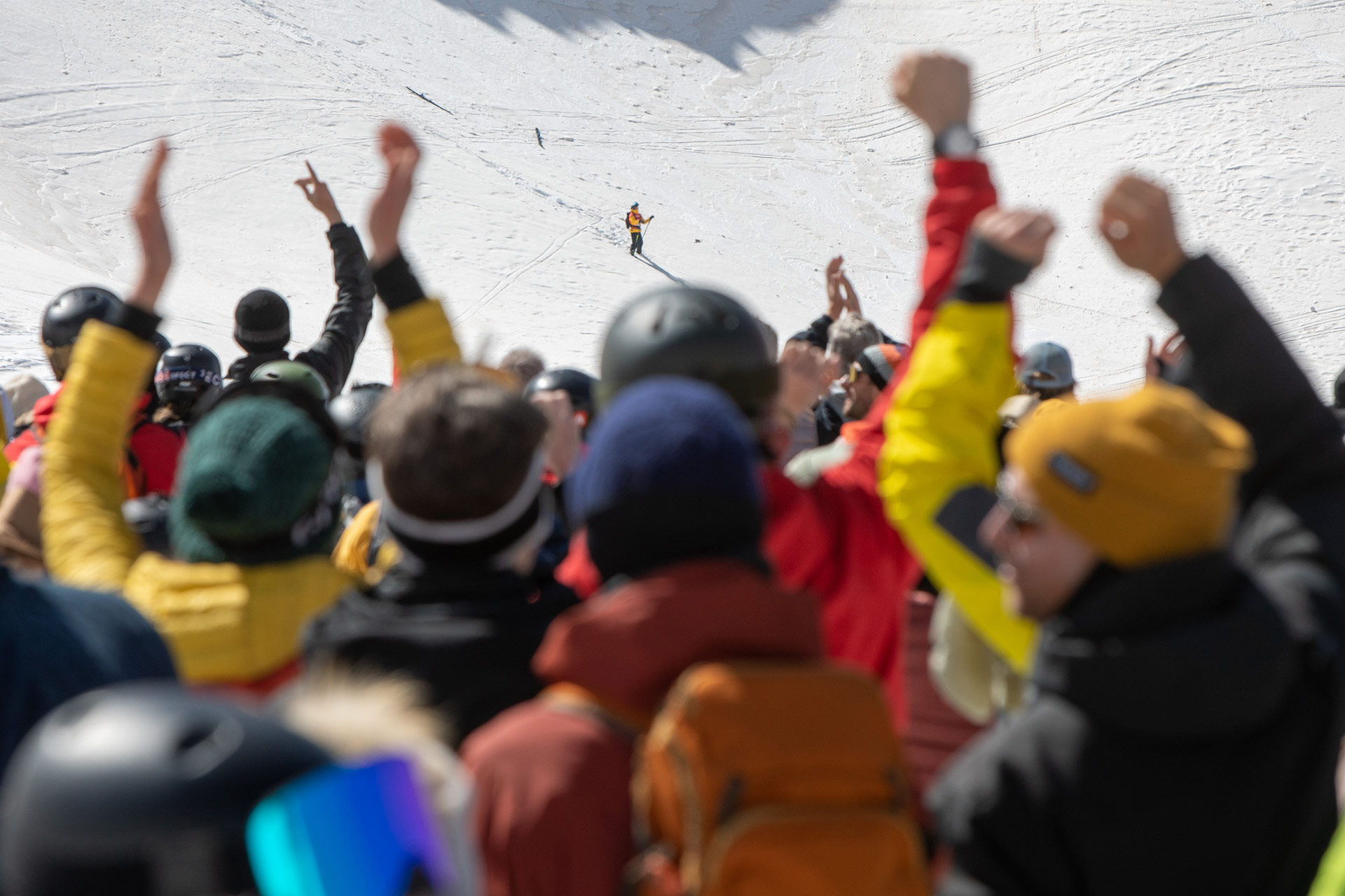 The crowd cheers on Abel Moga after his front flip attempt at the 2022 Xtreme Verbier Freeride World Tour Finals.